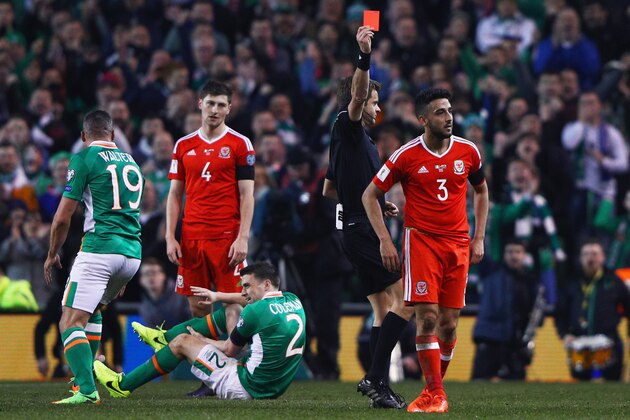 DUBLIN, IRELAND - MARCH 24:  Players react as Neil Taylor of Wales (3) is shown a red card by referee Nicola Rizzoli and is sent off after a challenge on Seamus Coleman of the Republic of Ireland (2) during the FIFA 2018 World Cup Qualifier between Republic of Ireland and Wales at Aviva Stadium on March 24, 2017 in Dublin, Ireland.  (Photo by Ian Walton/Getty Images)
