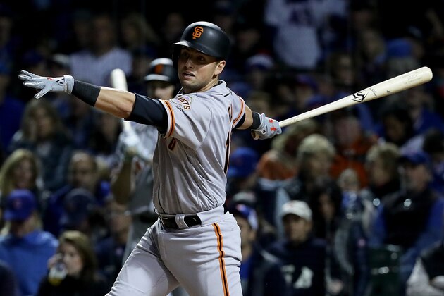 CHICAGO, ILLINOIS - OCTOBER 08:  Joe Panik #12 of the San Francisco Giants hits a double in the third inning against the Chicago Cubs at Wrigley Field on October 8, 2016 in Chicago, Illinois. (Photo by Jonathan Daniel/Getty Images)