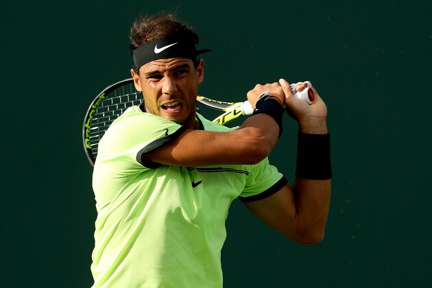 KEY BISCAYNE, FL - MARCH 24:  Rafael Nadal of Spain returns a shot to Dudi Sela of Israel during the Miami Open at the Crandon Park Tennis Center on March 24, 2017 in Key Biscayne, Florida.  (Photo by Matthew Stockman/Getty Images)