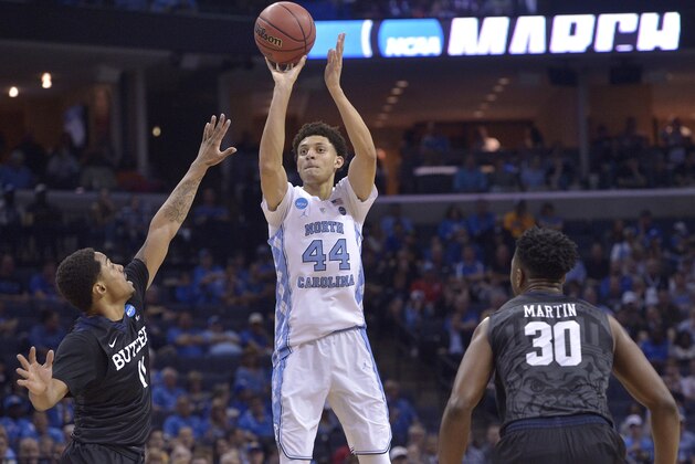 North Carolina forward Justin Jackson (44) shoots over Butler guard Kethan Savage (11) as Butler forward Kelan Martin (30) looks on in the first half of an NCAA college basketball tournament South Regional semifinal game Friday, March 24, 2017, in Memphis, Tenn. (AP Photo/Brandon Dill)