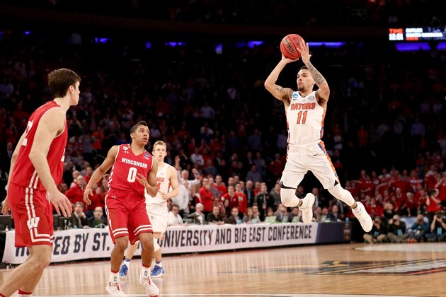 NEW YORK, NY - MARCH 24:  Chris Chiozza #11 of the Florida Gators shoots a game winning three point basket in overtime to defeat the Wisconsin Badgers with a score of 84 to 83 during the 2017 NCAA Men's Basketball Tournament East Regional at Madison Square Garden on March 24, 2017 in New York City.  (Photo by Maddie Meyer/Getty Images)