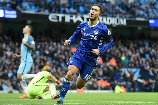 Chelsea's Belgian midfielder Eden Hazard celebrates scoring his team's third goal during the English Premier League football match between Manchester City and Chelsea at the Etihad Stadium in Manchester, north west England, on December 3, 2016. / AFP / Paul ELLIS / RESTRICTED TO EDITORIAL USE. No use with unauthorized audio, video, data, fixture lists, club/league logos or 'live' services. Online in-match use limited to 75 images, no video emulation. No use in betting, games or single club/league/player publications.  /         (Photo credit should read PAUL ELLIS/AFP/Getty Images)