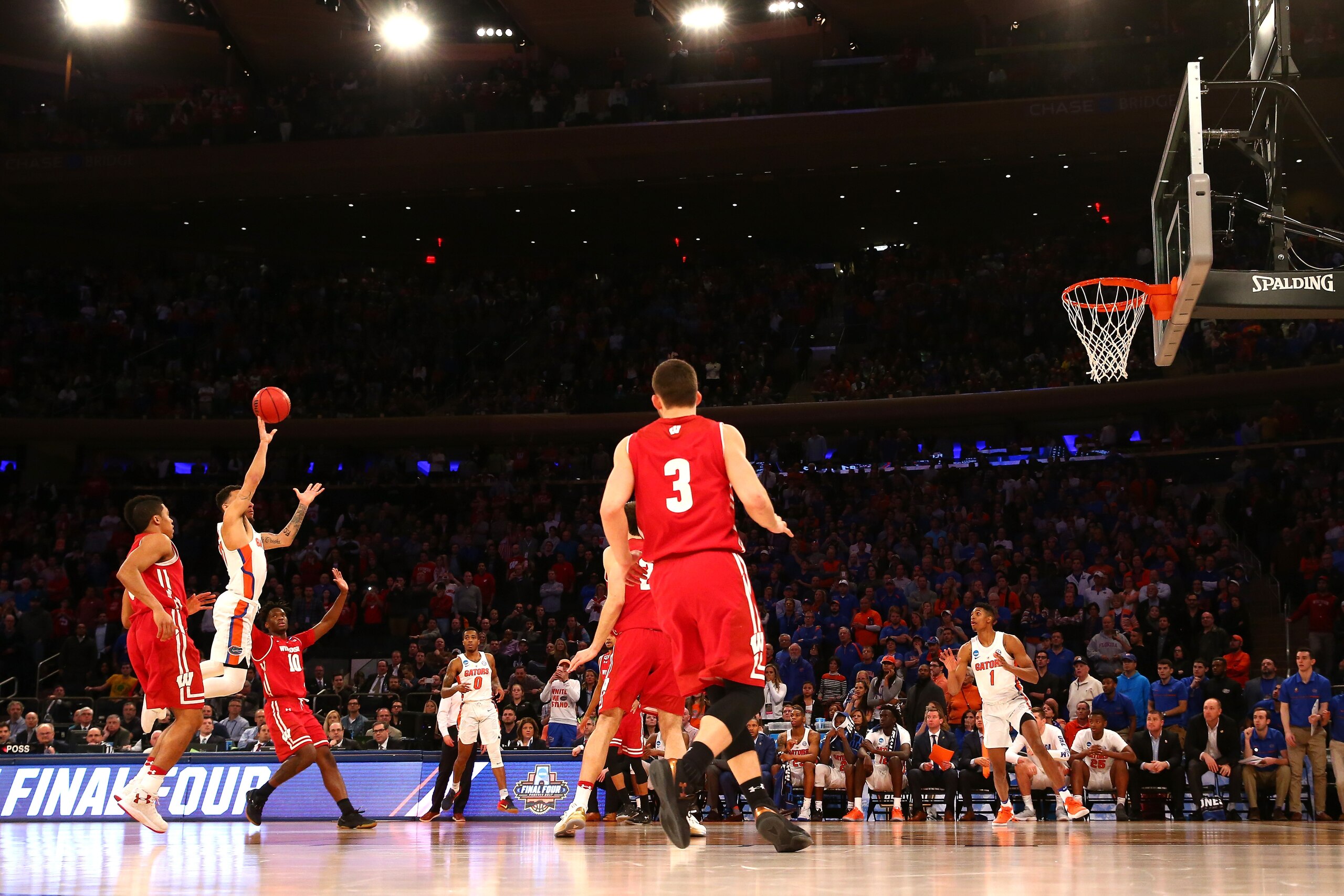 NEW YORK, NY - MARCH 24:  Chris Chiozza #11 of the Florida Gators shoots a game winning three point basket in overtime to defeat the Wisconsin Badgers with a score of 84 to 83 during the 2017 NCAA Men's Basketball Tournament East Regional at Madison Square Garden on March 24, 2017 in New York City.  (Photo by Maddie Meyer/Getty Images)