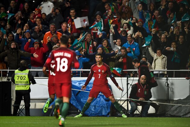 Portugal's forward Cristiano Ronaldo celebrates after scoring during the WC 2018 group B football qualifing match Portugal vs Hungary at the Luz stadium in Lisbon on March 25, 2017. / AFP PHOTO / PATRICIA DE MELO MOREIRA        (Photo credit should read PATRICIA DE MELO MOREIRA/AFP/Getty Images)