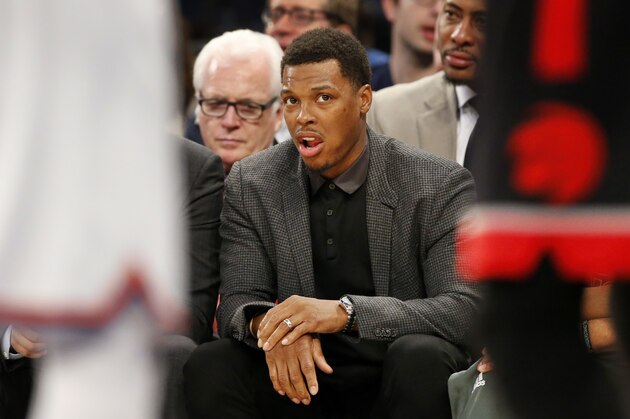 Toronto Raptors Kyle Lowry holds his right wrist as he watches from the bench during the first half of an NBA basketball game between the New York Knicks and the Toronto Raptors at Madison Square Garden in New York, Monday, Feb. 27, 2017. Lowry is scheduled to have wrist surgery Tuesday. (AP Photo/Kathy Willens)