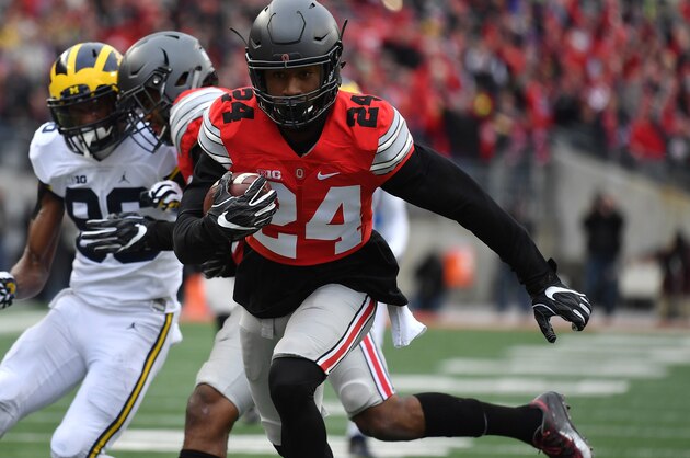 COLUMBUS, OH - NOVEMBER 26:   Malik Hooker #24 of the Ohio State Buckeyes runs for a touchdown after intercepting a pass by Wilton Speight #3 (not pictured) of the Michigan Wolverines during the first half of their game at Ohio Stadium on November 26, 2016 in Columbus, Ohio.  (Photo by Jamie Sabau/Getty Images)