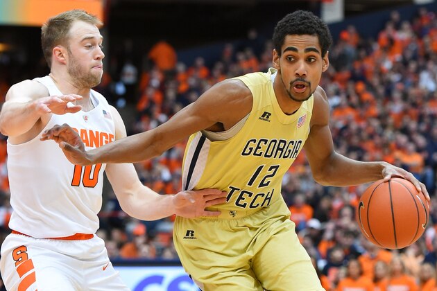 SYRACUSE, NY - JANUARY 30: Quinton Stephens #12 of the Georgia Tech Yellow Jackets drives to the basket against the defense of Trevor Cooney #10 of the Syracuse Orange during the first half at the Carrier Dome on January 30, 2016 in Syracuse, New York. Syracuse won 60-57. (Photo by Rich Barnes/Getty Images)
