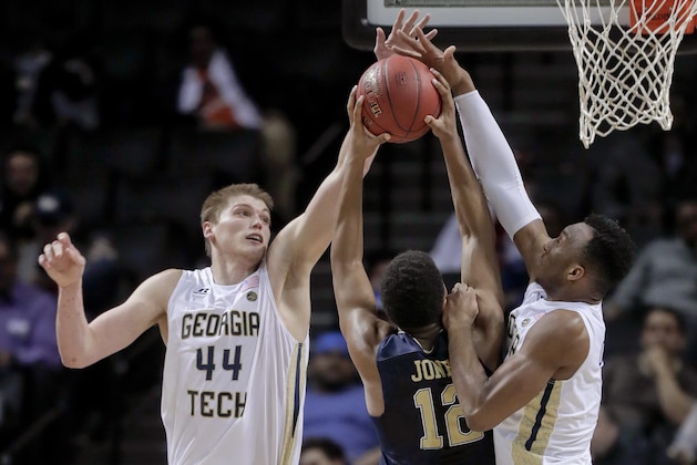 Georgia Tech center Ben Lammers (44) and guard Josh Okogie (5) block a shot attempt by Pittsburgh guard Chris Jones (12) during the second half of an NCAA college basketball game in the first round of the ACC tournament, Tuesday, March 7, 2017, in New York. Pittsburgh won 61-59. (AP Photo/Julie Jacobson)