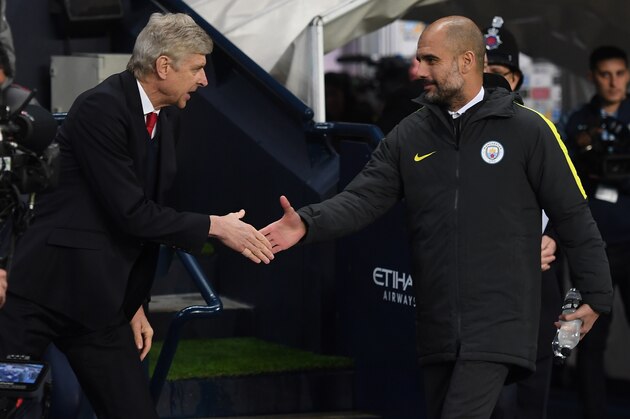 MANCHESTER, ENGLAND - DECEMBER 18:  Arsene Wenger, Manager of Arsenal (L) and Josep Guardiola, Manager of Manchester City (R) shake hands prior to kick off during the Premier League match between Manchester City and Arsenal at the Etihad Stadium on December 18, 2016 in Manchester, England.  (Photo by Michael Regan/Getty Images)