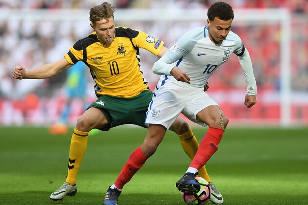 LONDON, ENGLAND - MARCH 26:  Dele Ali of England holds off Arturas Zulpa of Lithuania during the FIFA 2018 World Cup Qualifier between England and Lithuania at Wembley Stadium on March 26, 2017 in London, England.  (Photo by Mike Hewitt/Getty Images)