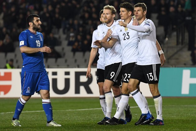 From L: Germany's Jonas Hector, Andre Schuerrle, Mario Gomez and Thomas Mueller celebrate a goal during the FIFA World Cup 2018 qualification football match between Azerbaijan and Germany in Baku on March 26, 2017. / AFP PHOTO / Kirill KUDRYAVTSEV        (Photo credit should read KIRILL KUDRYAVTSEV/AFP/Getty Images)