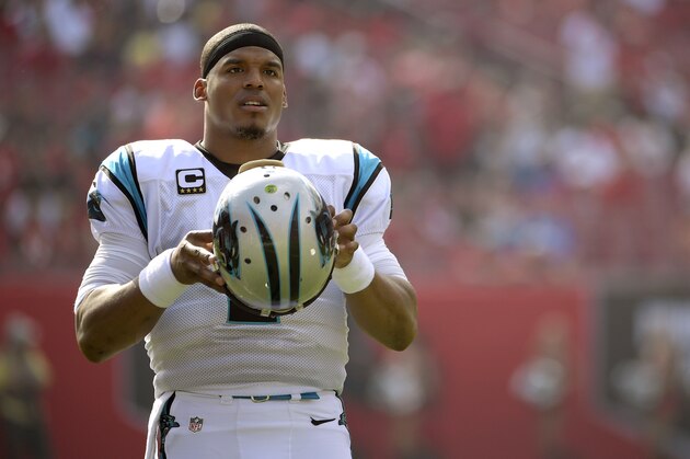 FILE - In this Jan. 1, 2017, file photo, Carolina Panthers quarterback Cam Newton (1) puts on his helmet during the first quarter of an NFL football game against the Tampa Bay Buccaneers Sunday, Jan. 1, 2017, in Tampa, Fla. Newton will undergo surgery at the end of this month to repair a partially torn rotator cuff in his right throwing shoulder. Panthers spokesman Steve Drummond says the 27-year-old Newton will miss minicamp and OTAs, but is expected to be ready for the start of training camp in late July.(AP Photo/Phelan Ebenhack, File)