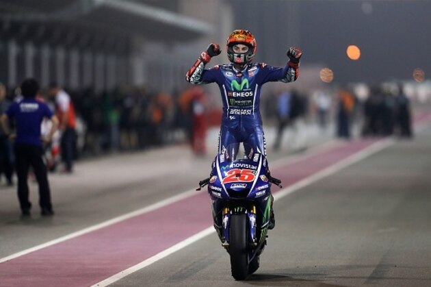 Movistar Yamaha MotoGP's Spanish rider Maverick Vinales celebrates after winning the 2017 Qatar MotoGP at the Losail International Circuit, north of the capital Doha on March 26, 2017.
Spain's Maverick Vinales of Movistar Yamaha MotoGP won the season-opening Qatar MotoGP on March 26, 2017, shrugging off a poor start from pole position under the desert floodlights. Defending world champion Marc Marquez was fourth on a Honda. / AFP PHOTO / Karim JAAFAR (Photo credit should read KARIM JAAFAR/AFP/Getty Images) Movistar Yamaha MotoGP's Spanish rider Maverick Vinales celebrates after winning the 2017 Qatar MotoGP at the Losail International Circuit, north of the capital Doha on March 26, 2017.
Spain's Maverick Vinales of Movistar Yamaha MotoGP won the season-opening Qatar MotoGP on March 26, 2017, shrugging off a poor start from pole position under the desert floodlights. Defending world champion Marc Marquez was fourth on a Honda. / AFP PHOTO / Karim JAAFAR (Photo credit should read KARIM JAAFAR/AFP/Getty Images)