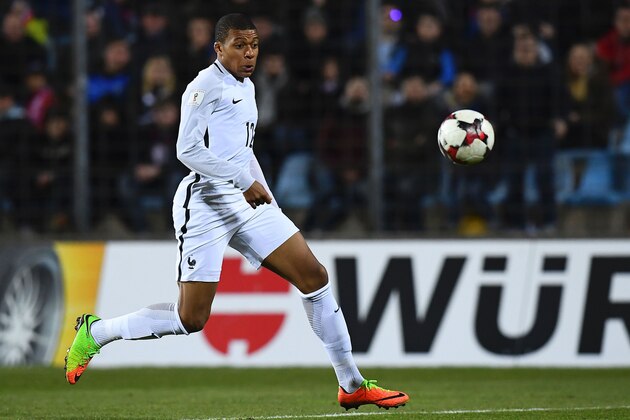 France's forward Kylian Mbappe eyes the ball during the FIFA World Cup 2018 qualifying football match Luxembourg vs France on March 25, 2017 at the Josy Bartel Stadium in Luxembourg.  / AFP PHOTO / FRANCK FIFE        (Photo credit should read FRANCK FIFE/AFP/Getty Images)