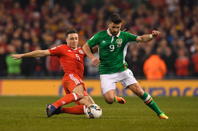 DUBLIN, IRELAND - MARCH 24:  James Chester of Wales stretches to tackle Shane Long of the Republic of Ireland during the FIFA 2018 World Cup Qualifier between Republic of Ireland and Wales at Aviva Stadium on March 24, 2017 in Dublin, Ireland.  (Photo by Stu Forster/Getty Images)