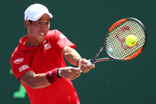 KEY BISCAYNE, FL - MARCH 26:  Kei Nishikori of Japan returns a shot against Fernando Verdasco of Spain during Day 7 of the Miami Open at Crandon Park Tennis Center on March 26, 2017 in Key Biscayne, Florida.  (Photo by Al Bello/Getty Images)