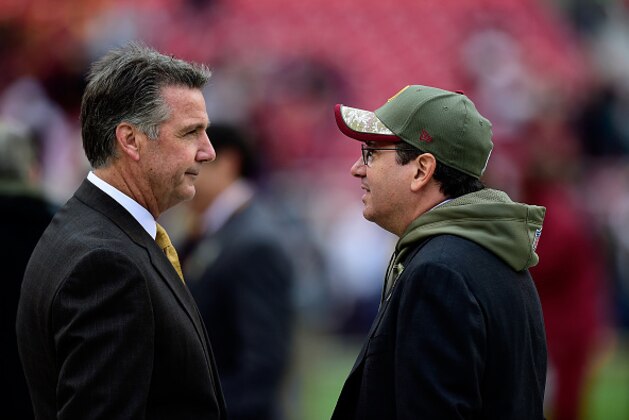 LANDOVER, MD - NOVEMBER 16:  Washington Redskins Owner Dan Snyder (Right) speaks with General Manager Bruce Allen before a game against the Tampa Bay Buccaneers at FedExField on November 16, 2014 in Landover, Maryland.  (Photo by Patrick McDermott/Getty Images)