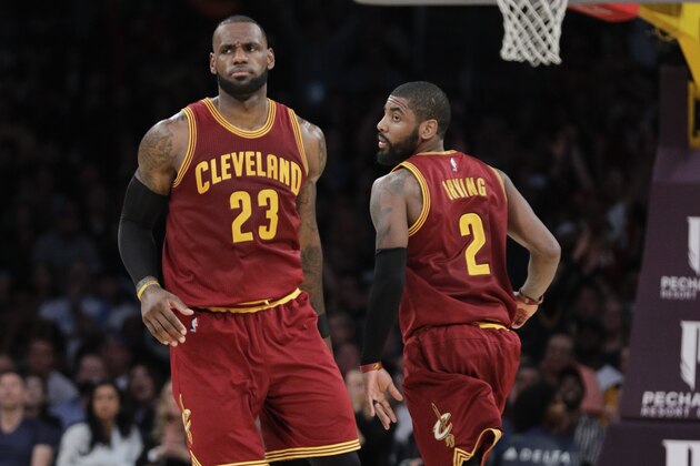 Cleveland Cavaliers' LeBron James greets Kyrie Irving during the second half of an NBA basketball game against the Los Angeles Lakers Sunday, March 19, 2017, in Los Angeles. (AP Photo/Jae C. Hong)