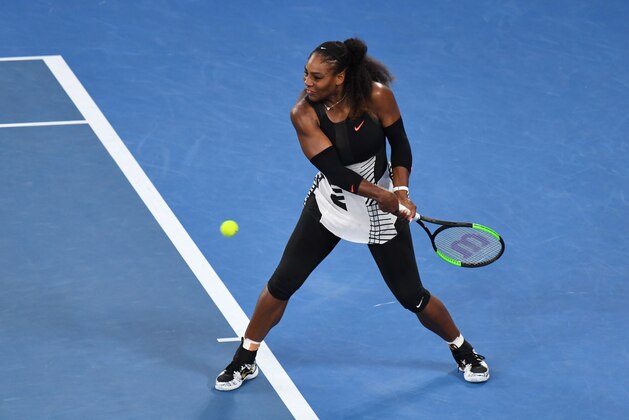 Serena Williams of the US hits a return against Venus Williams of the US during the women's singles final on day 13 of the Australian Open tennis tournament in Melbourne on January 28, 2017. / AFP / Greg Wood / IMAGE RESTRICTED TO EDITORIAL USE - STRICTLY NO COMMERCIAL USE        (Photo credit should read GREG WOOD/AFP/Getty Images)