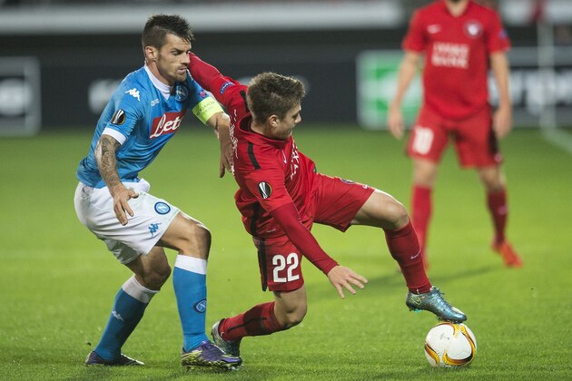Mikkel Duelund of FC Midtjylland (R) in action against Christian Maggio of Napoli during the UEFA Europa Leage football match FC Midtjylland v SSC Napoli in Herning on October 22, 2015. AFP PHOTO / SCANPIX DENMARK / CLAUS FISKER  +++ DENAMRK OUT+++        (Photo credit should read CLAUS FISKER/AFP/Getty Images)