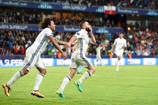 Real Madrid's Spanish defender Dani Carvajal celebrates with his teammate Brazilian defender Marcelo (L) after scoring the 3-2 goal at overtime during the UEFA Super Cup final football match between Real Madrid CF and Sevilla FC on August 9, 2016 at the Lerkendal Stadion in Trondheim. Real Madrid won 3-2. / AFP / JONATHAN NACKSTRAND        (Photo credit should read JONATHAN NACKSTRAND/AFP/Getty Images)