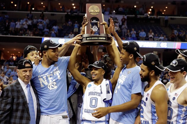 MEMPHIS, TN - MARCH 26:  The North Carolina Tar Heels hold up the South Regional Champion trophy after defeating the Kentucky Wildcats during the 2017 NCAA Men's Basketball Tournament South Regional at FedExForum on March 26, 2017 in Memphis, Tennessee.  (Photo by Andy Lyons/Getty Images)