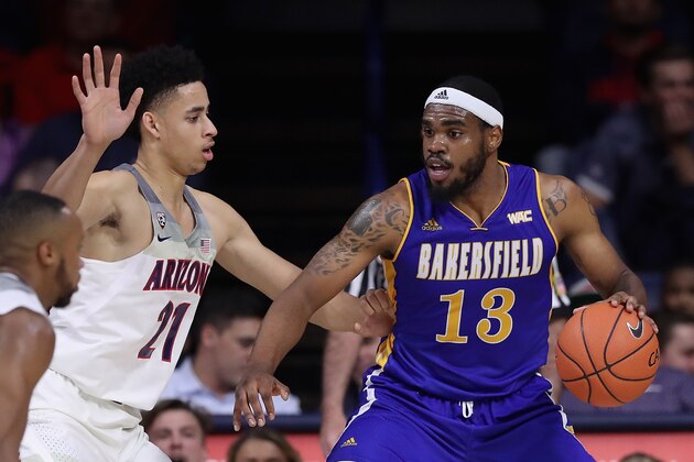 TUCSON, AZ - NOVEMBER 15:  Shon Briggs #13 of the Cal State Bakersfield Roadrunners handles the ball against Chance Comanche #21 of the Arizona Wildcats during the first half of the college basketball game at McKale Center on November 15, 2016 in Tucson, Arizona.  (Photo by Christian Petersen/Getty Images)