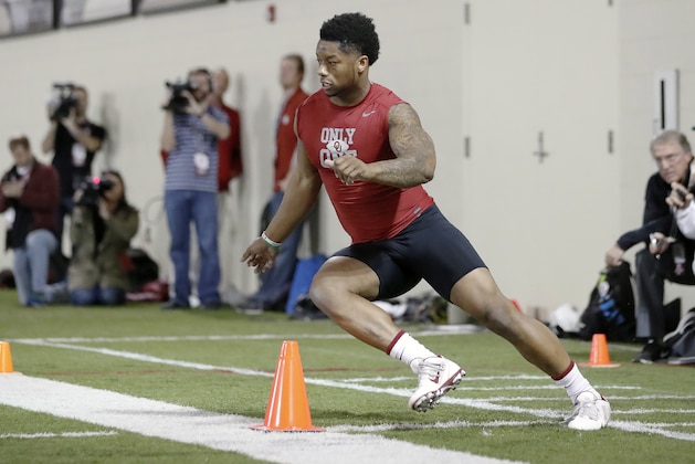 Running back Joe Mixon runs a drill at Oklahoma's Pro Day, Wednesday, March 8, 2017, in Norman, Okla. The event is to showcase players for the upcoming NFL football draft. (AP Photo/Alonzo Adams)
