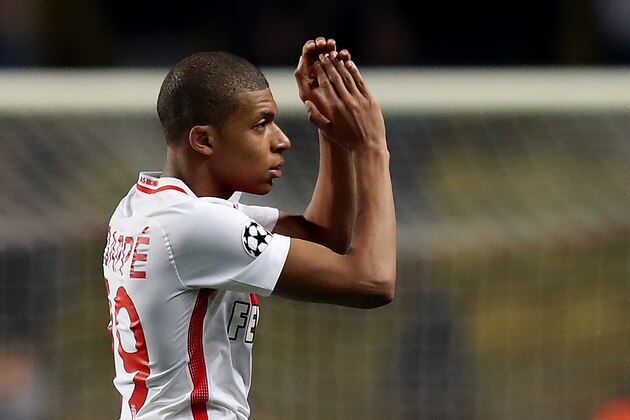 Monaco's French forward Kylian Mbappe Lottin acknowledges supporters during the UEFA Champions League round of 16 football match between Monaco and Manchester City at the Stade Louis II in Monaco on March 15, 2017. / AFP PHOTO / Valery HACHE        (Photo credit should read VALERY HACHE/AFP/Getty Images)