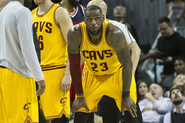 Cleveland Cavaliers' LeBron James (23) catches his breath after being hit in the groin during the second half of an NBA basketball game against the Washington Wizards in Cleveland, Saturday, March 25, 2017. (AP Photo/Phil Long)