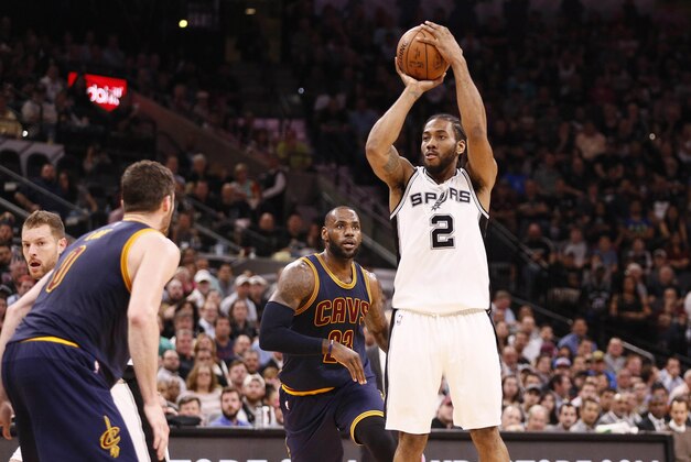 Mar 27, 2017; San Antonio, TX, USA; San Antonio Spurs small forward Kawhi Leonard (2) shoots the ball against the Cleveland Cavaliers during the first half at AT&T Center. Mandatory Credit: Soobum Im-USA TODAY Sports