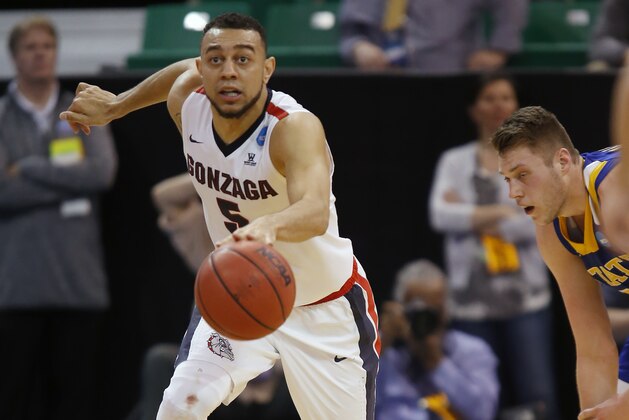 Gonzaga guard Nigel Williams-Goss (5) moves the ball down court after stealing it from South Dakota State forward Mike Daum, right, during the first half of a first-round men's college basketball in the NCAA Tournament, Thursday, March 16, 2017, in Salt Lake City. (AP Photo/George Frey)