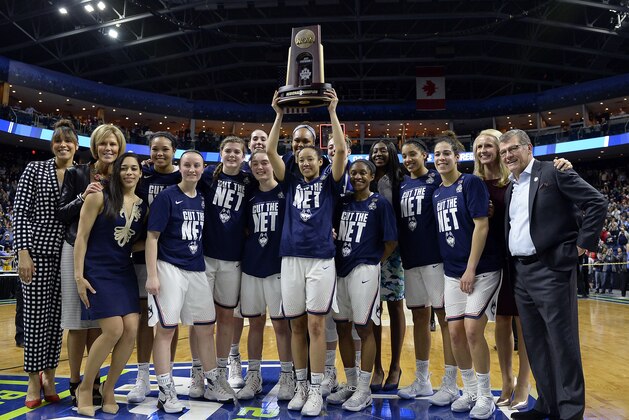 Connecticut's Saniya Chong holds the trophy as she poses with her teammates following their 90-52 win over Oregon in a regional final game in the NCAA women's college basketball tournament, Monday, March 27, 2017, in Bridgeport, Conn. (AP Photo/Jessica Hill)