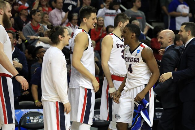 SAN JOSE, CA - MARCH 25:  Jordan Mathews #4 of the Gonzaga Bulldogs is congratulated by his teammates as he comes out of the game against the Xavier Musketeers during the 2017 NCAA Men's Basketball Tournament West Regional at SAP Center on March 25, 2017 in San Jose, California.  (Photo by Sean M. Haffey/Getty Images)