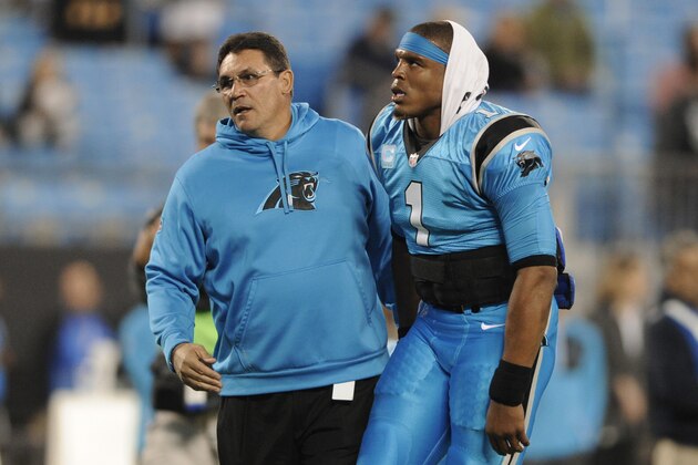 Carolina Panthers head coach Ron Rivera, left, greets Cam Newton, right, before an NFL football game against the New Orleans Saints in Charlotte, N.C., Thursday, Nov. 17, 2016. (AP Photo/Mike McCarn)
