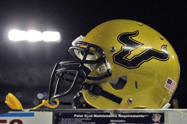 TAMPA, FL - SEPTEMBER 12:  Detail view of a football helmet of the University of South Florida Bulls resting behind the bench during play against the Kansas University Jayhawks at Raymond James Stadium on September 12, 2008 in Tampa, Florida.  (Photo by Al Messerschmidt/Getty Images)