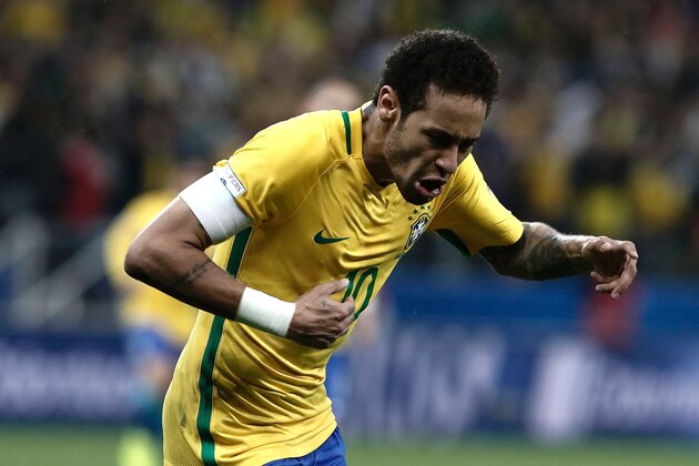 Brazil's forward Neymar celebrates during their 2018 FIFA World Cup qualifier football match against Paraguay in Sao Paulo, Brazil on March 28, 2017. / AFP PHOTO / Miguel SCHINCARIOL        (Photo credit should read MIGUEL SCHINCARIOL/AFP/Getty Images)