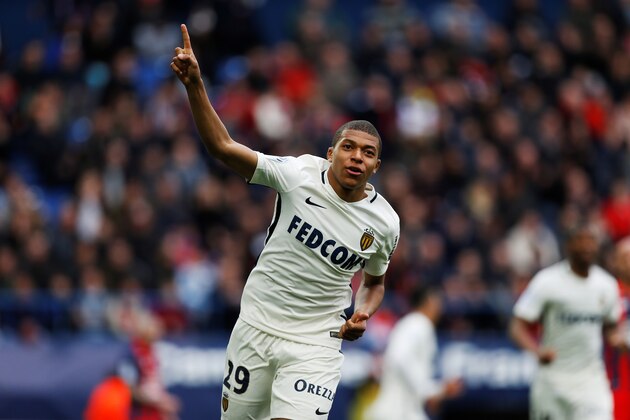 Monaco's French forward Kylian Mbappe Lottin celebrates after scoring a goal during the French L1 football match between Caen (SMC) and Monaco (AS), on March 19, 2017 at the Michel d'Ornano stadium, in Caen, northwestern France. / AFP PHOTO / CHARLY TRIBALLEAU        (Photo credit should read CHARLY TRIBALLEAU/AFP/Getty Images)