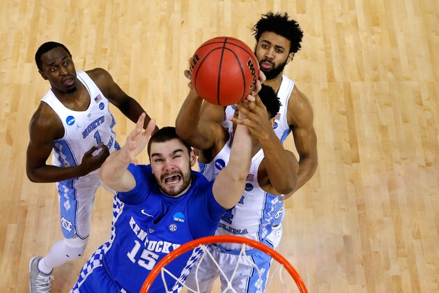 MEMPHIS, TN - MARCH 26: Isaac Humphries #15 of the Kentucky Wildcats competes for a rebound with Theo Pinson #1, Isaiah Hicks #4 and Joel Berry II #2 of the North Carolina Tar Heels in the first half during the 2017 NCAA Men's Basketball Tournament South Regional at FedExForum on March 26, 2017 in Memphis, Tennessee.  (Photo by Andy Lyons/Getty Images)