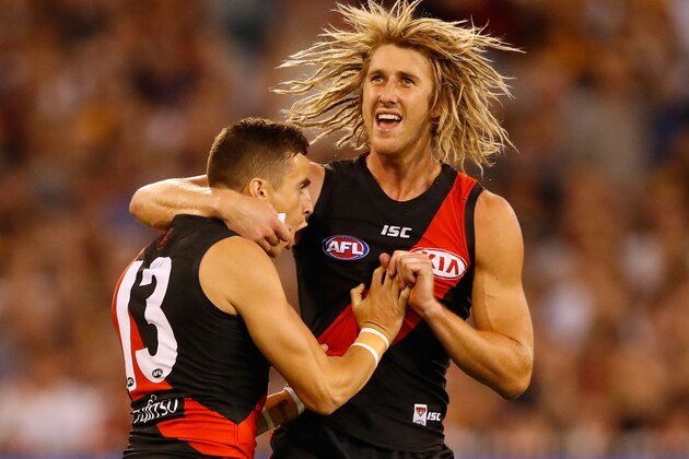 MELBOURNE, AUSTRALIA - MARCH 25: Orazio Fantasia of the Bombers celebrates the first goal with Dyson Heppell of the Bombers during the 2017 AFL round 01 match between the Essendon Bombers and the Hawthorn Hawks at the Melbourne Cricket Ground on March 25, 2017 in Melbourne, Australia. (Photo by Adam Trafford/AFL Media/Getty Images)