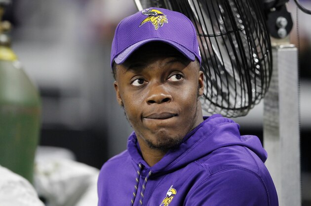 Injured Minnesota Vikings quarterback Teddy Bridgewater sits on the bench before an NFL football game against Dallas Cowboys Thursday, Dec. 1, 2016, in Minneapolis. (AP Photo/Andy Clayton-King)