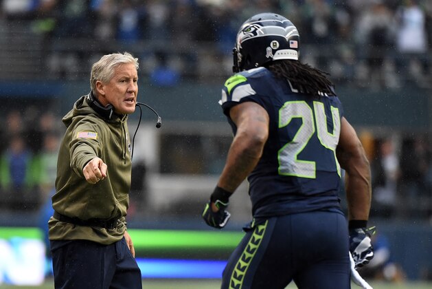 SEATTLE, WA - NOVEMBER 09: Head coach Pete Carroll of the Seattle Seahawks greets running back Marshawn Lynch #24 of the Seattle Seahawks as Lynch comes off the field after scoring a touchdown during the first quarter off the game at CenturyLink Field on November 9, 2014 in Seattle, Washington.  (Photo by Steve Dykes/Getty Images)