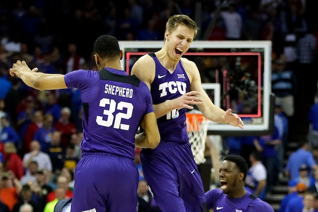 KANSAS CITY, MO - MARCH 09:  Vladimir Brodziansky #10 and Karviar Shepherd #32 of the TCU Horned Frogs celebrate as the Horned Frogs defeat the Kansas Jayhawks 85-82 to win the quarterfinal game of the Big 12 Basketball Tournament at the Sprint Center on March 9, 2017 in Kansas City, Missouri.  (Photo by Jamie Squire/Getty Images)
