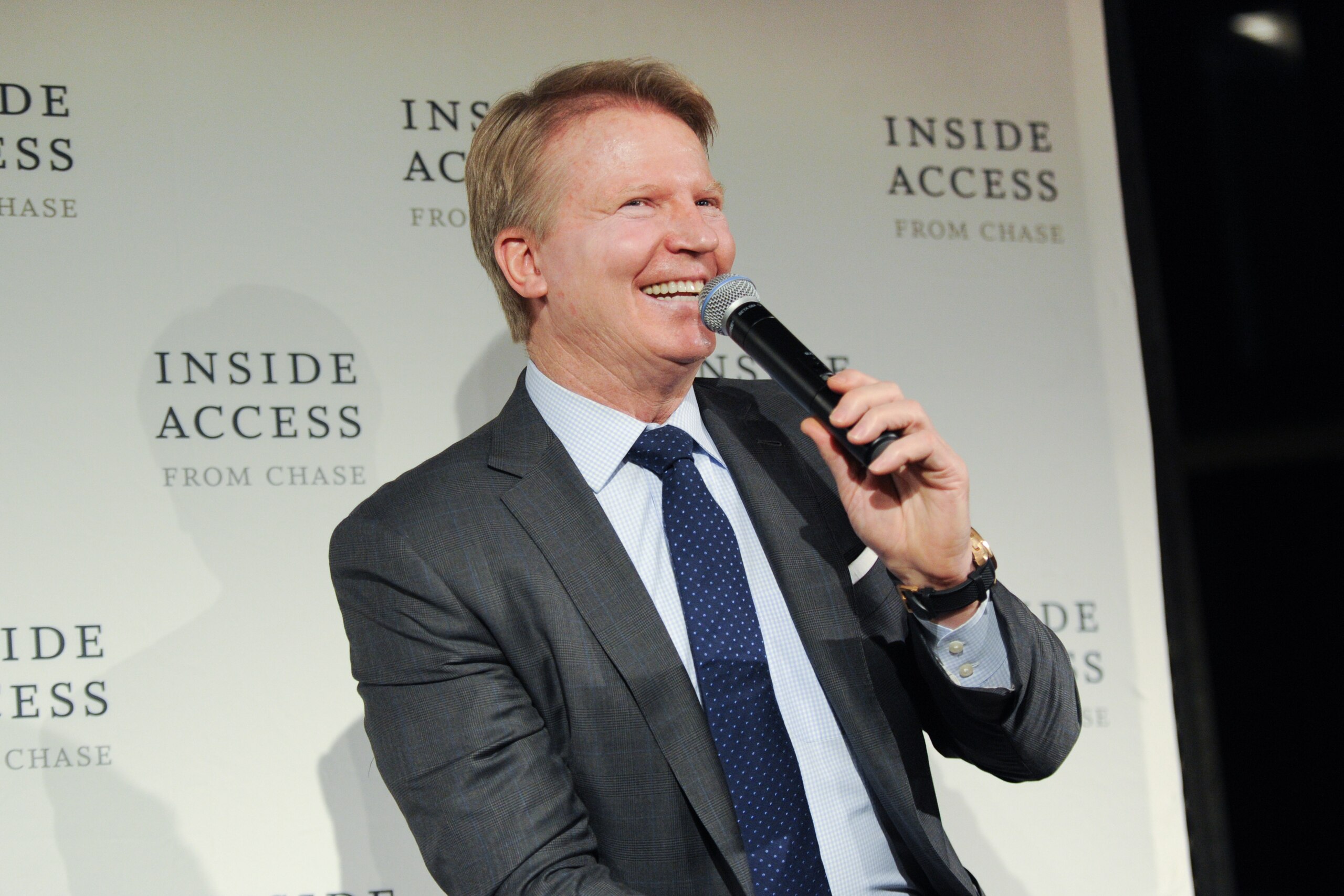 IMAGE DISTRIBUTED FOR CHASE - Football legend Phil Simms visits the Chase VIP lounge to talk football, answer questions and sign autographs for United MileagePlus cardholders in celebration of