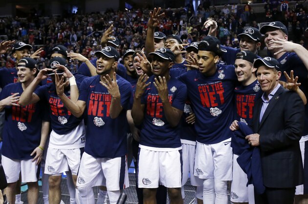 Gonzaga players celebrate after beating Xavier during an NCAA Tournament college basketball regional final game Saturday, March 25, 2017, in San Jose, Calif. (AP Photo/Tony Avelar)