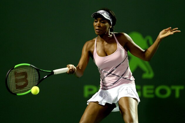 KEY BISCAYNE, FL - MARCH 27:  Venus Williams returns a shot to Svetlana Kuznetsova of Russia during the Miami Open at the Crandon Park Tennis Center on March 27, 2017 in Key Biscayne, Florida.  (Photo by Matthew Stockman/Getty Images)