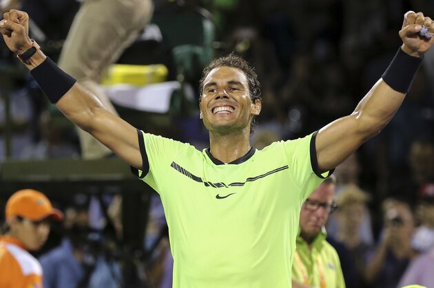 Rafael Nadal, of Spain, celebrates to the crowd with open arms his straight set victory against Jack Sock, of the United States, during a quarterfinal match at the Miami Open tennis tournament, Wednesday, March 29, 2017, in Key Biscayne, Fla. (AP Photo/Mario Houben)