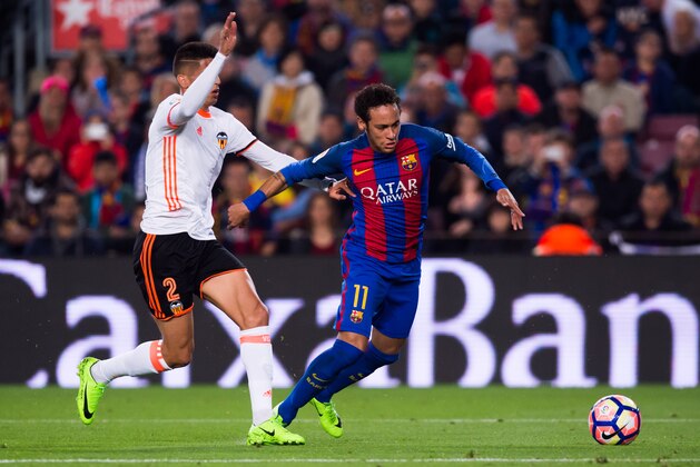 BARCELONA, SPAIN - MARCH 19:  Neymar Santos Jr (R) of FC Barcelona competes for the ball with Joao Cancelo (L) of Valencia CF during the La Liga match between FC Barcelona and Valencia CF at Camp Nou stadium on March 19, 2017 in Barcelona, Spain.  (Photo by Alex Caparros/Getty Images)
