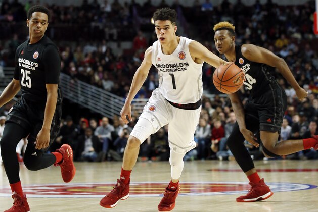 Big West's Michael Porter Jr (1) controls the ball against Big East during the first half of the McDonald's All- American boys high school basketball game in Chicago, Wednesday, March 29, 2017. (AP Photo/Nam Y. Huh)