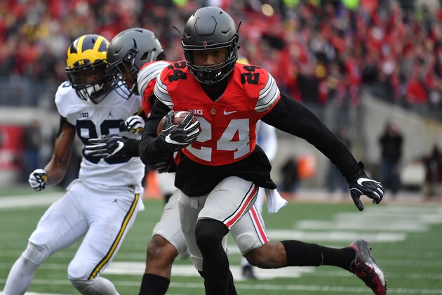 COLUMBUS, OH - NOVEMBER 26: Malik Hooker #24 of the Ohio State Buckeyes runs for a touchdown after intercepting a pass by Wilton Speight #3 (not pictured) of the Michigan Wolverines during the first half of their game at Ohio Stadium on November 26, 2016 in Columbus, Ohio. (Photo by Jamie Sabau/Getty Images) COLUMBUS, OH - NOVEMBER 26: Malik Hooker #24 of the Ohio State Buckeyes runs for a touchdown after intercepting a pass by Wilton Speight #3 (not pictured) of the Michigan Wolverines during the first half of their game at Ohio Stadium on November 26, 2016 in Columbus, Ohio. (Photo by Jamie Sabau/Getty Images)